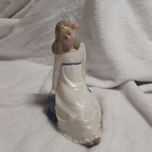 Nadal Girl with Flower in Hair on Ottoman